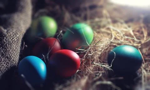 Easter painted eggs on burlap 스톡 사진