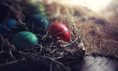 Easter painted eggs on burlap 스톡 사진