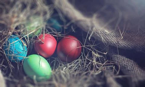 Easter painted eggs on burlap 스톡 사진