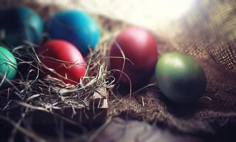 Easter painted eggs on burlap 스톡 사진