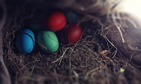 Easter painted eggs on burlap 스톡 사진