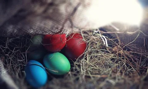 Easter painted eggs on burlap 스톡 사진