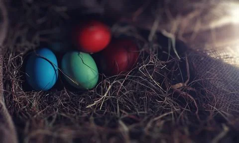 Easter painted eggs on burlap 스톡 사진