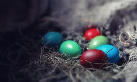 Easter painted eggs on burlap 스톡 사진