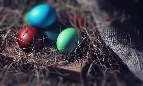 Easter painted eggs on burlap 스톡 사진
