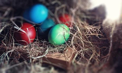 Easter painted eggs on burlap 스톡 사진