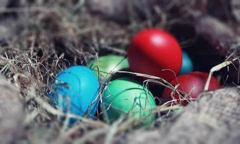 Easter painted eggs on burlap 스톡 사진