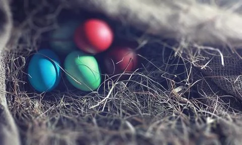 Easter painted eggs on burlap 스톡 사진