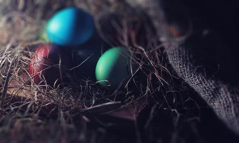 Easter painted eggs on burlap 스톡 사진