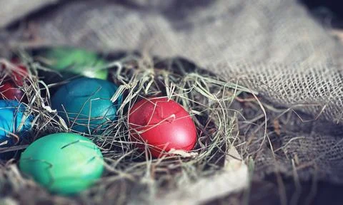 Easter painted eggs on burlap 스톡 사진