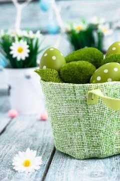 Easter. Painted Eggs on Easter table. Easter Egg in the Basket. Easter Decora Stock Photos