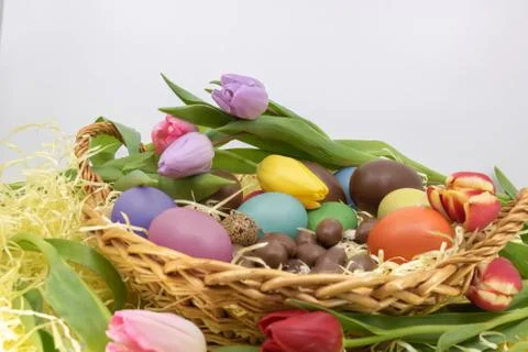 Easter party and arrival of spring with its symbols, eggs and tulips Stock Photos