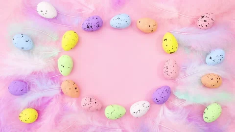 Easter pastel colored eggs and feathers with place for text. Stop motion Stock Footage 147738391