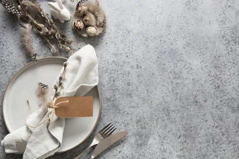 Easter pastel holiday table setting on grey stone table. Top view. Banner. Stock Photos
