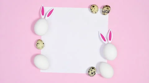 Easter pastel pink background with paper and eggs. Stop motion Video stock 171446531