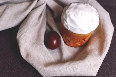 Easter pastries and colored eggs on a textile background. Traditional pastries Stock Photos
