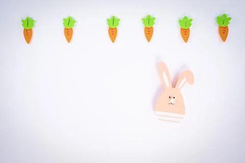 Easter pattern with carrots and a cute Easter bunny Stock Photos