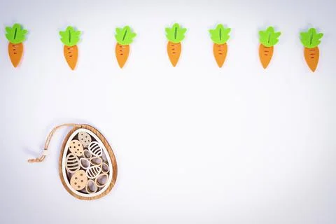 Easter pattern with carrots and cute Easter egg decoration Stock Photos