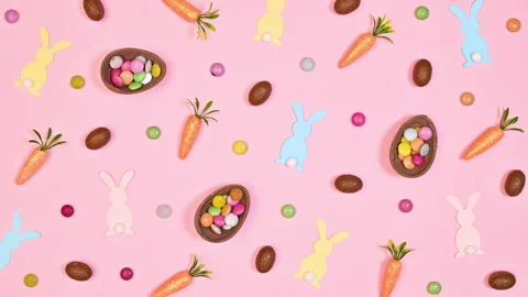 Easter pattern with chocolate eggs, rabbits and carrots move Stop motion Vídeo Stock 233230458