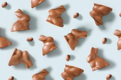 Easter pattern with chocolate sweets rabbits or bunny and eggs. Stock Photos
