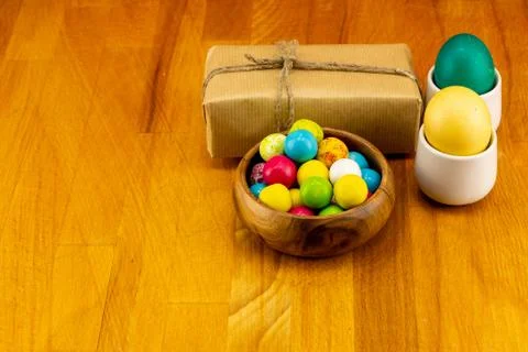 Easter pattern design giftbox craft brown pair eggs green yellow candy dragee Stock Photos
