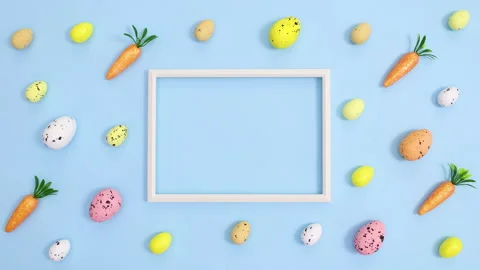 Easter pattern with eggs and carrots and copy space frame Stop motion flat lay Stock Footage 149926273