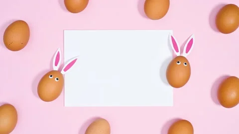 Easter pattern with paper card copy space and eggs. Stop motion Stock Footage 171364364