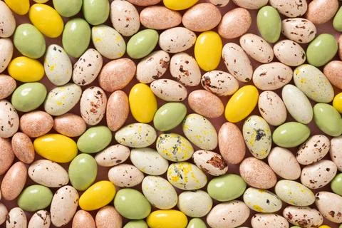 Easter pattern with pastel chocolate eggs on blue background. 스톡 사진