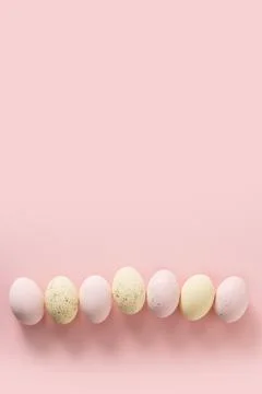 Easter pattern with pastel colorful eggs on pink background. Stock Photos