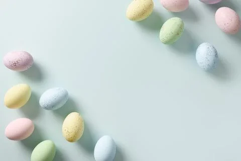 Easter pattern with pastel eggs on blue background. Stock Photos