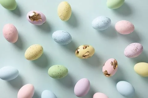 Easter pattern with pastel eggs on blue background. Stock Photos