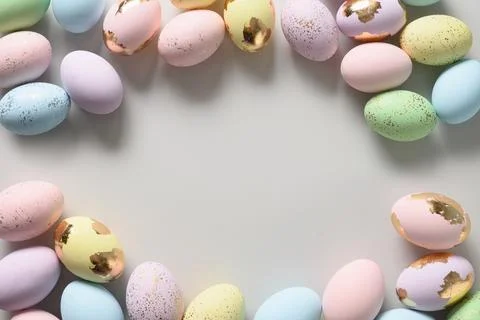 Easter pattern with pastel eggs on blue background. Stock Photos