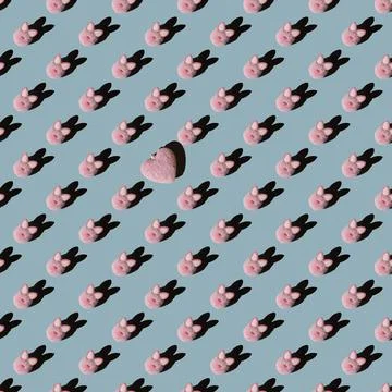 Easter pattern, pink bunny on a blue background. 스톡 사진