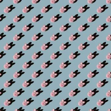 Easter pattern, pink bunny on a blue background. 스톡 사진