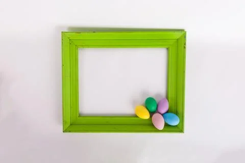 Easter picture frame with bunch a Easter eggs in corner of frame Stock Photos