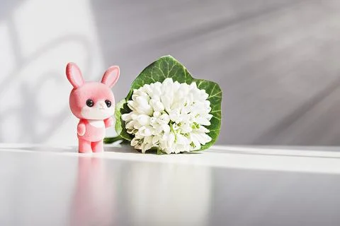 Easter pink bunny, rabbit with spring snowdrops Stock Photos
