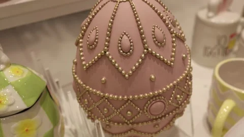 Easter pink decorative egg with golden ornament Video stock 332331687