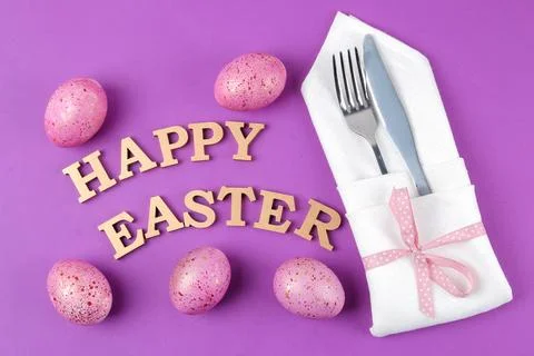 Easter. Pink easter eggs and knife with fork. Easter table setting. on trendy Stock Photos