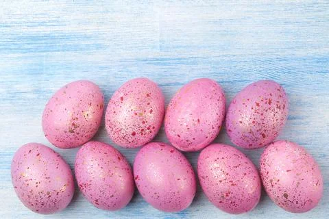 Easter. Pink easter eggs on a blue wooden table. Happy easter. holidays. top Stock Photos