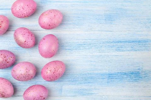 Easter. Pink easter eggs on a blue wooden table. Happy easter. holidays. top Stock Photos