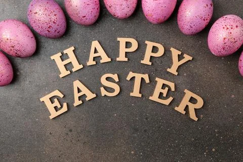 Easter. pink easter eggs on dark background. Happy easter. holidays. top view Stock Photos
