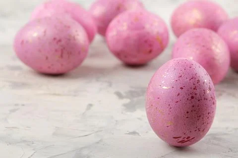 Easter. Pink Easter eggs on a light concrete background. Happy easter. holida Stock Photos