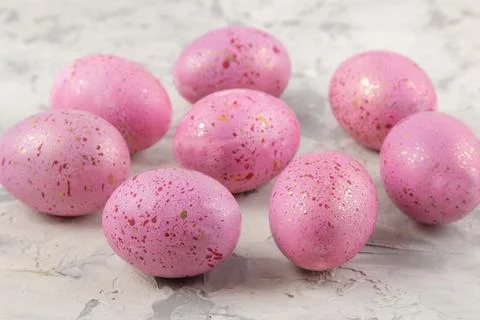 Easter. Pink Easter eggs on a light concrete background. Happy easter. holida Stock Photos