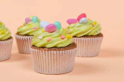 Easter pistachio cupcake with decorations Stock Photos