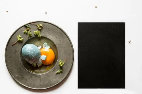 Easter place setting menu with broken egg, dyed blue Stock Photos