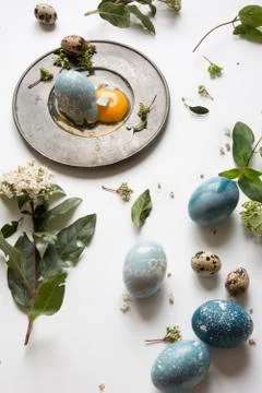 Easter place setting menu with broken egg, dyed blue Stock Photos