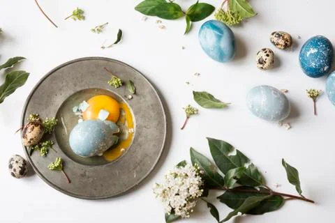 Easter place setting menu with broken egg, dyed blue Stock Photos