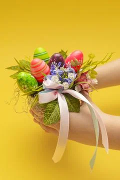 Easter postcard. Decorative bouquet for Easter in the hands of a child. Child Stock Photos
