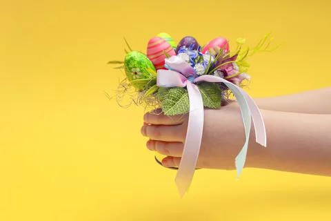 Easter postcard. Decorative bouquet for Easter in the hands of a child. Child Stock Photos