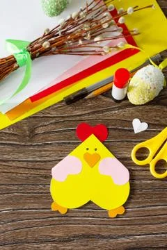 Easter postcard Easter chicken on a wooden table. Handmade. Stock Photos